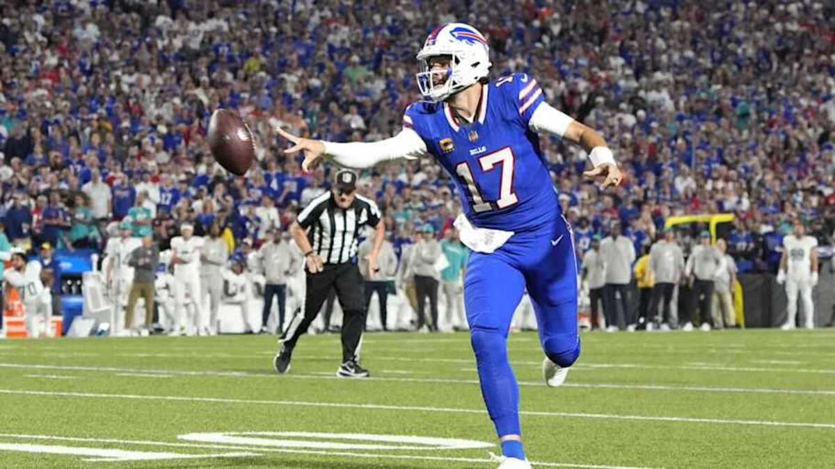 Sep 18, 2025; Orchard Park, New York, USA; Buffalo Bills quarterback Josh Allen (17) makes a pass for a touchdown against the Miami Dolphins in the second quarter at Highmark Stadium. Mandatory Credit: Gregory Fisher-Imagn Images | Gregory Fisher-Imagn Images