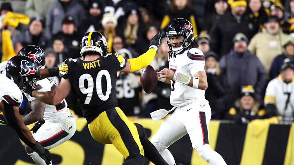  Jan 12, 2026; Pittsburgh, PA, USA; Houston Texans quarterback C.J. Stroud (7) scrambles against Pittsburgh Steelers linebacker T.J. Watt (90) during the second half of an AFC Wild Card Round game at Acrisure Stadium. Mandatory Credit: Charles LeClaire-Imagn Images | Charles LeClaire-Imagn Images 