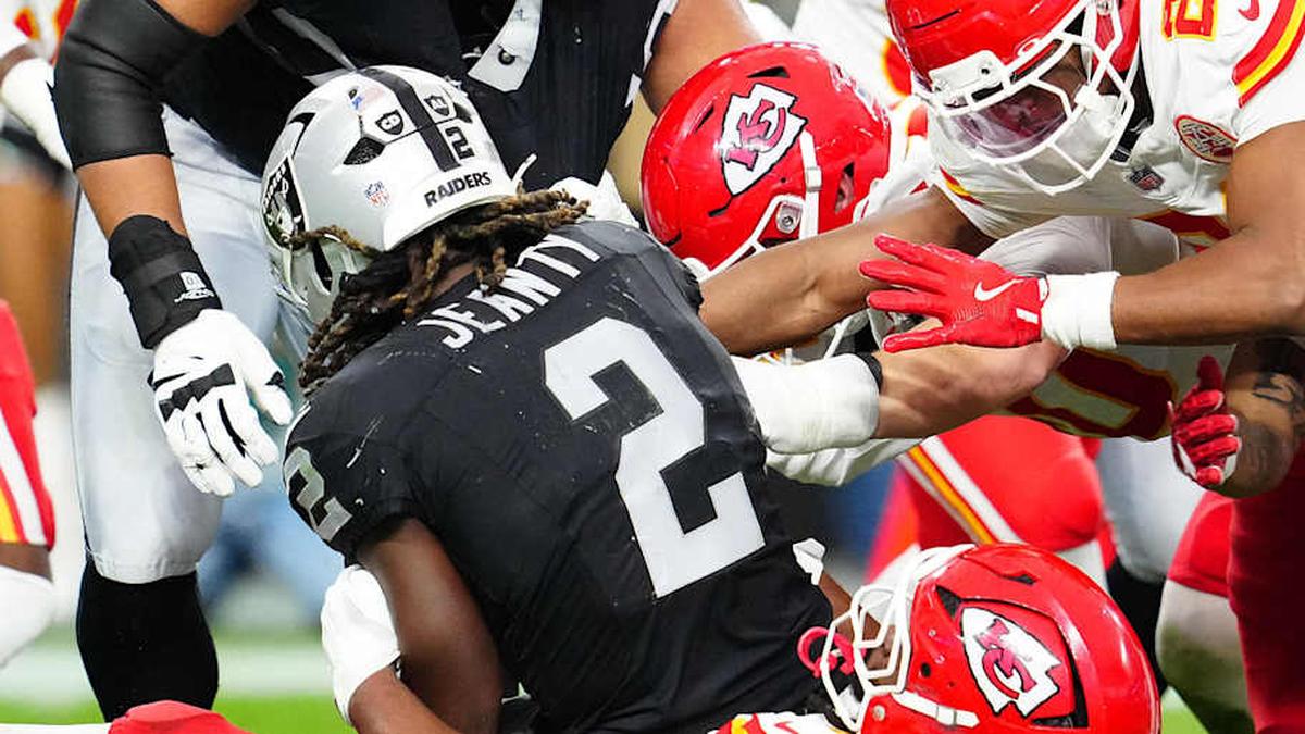  Jan 4, 2026; Paradise, Nevada, USA; Las Vegas Raiders running back Ashton Jeanty (2) is tackled by Kansas City Chiefs defensive tackle Derrick Nnadi (92) during the second quarter at Allegiant Stadium. Mandatory Credit: Stephen R. Sylvanie-Imagn Images | Stephen R. Sylvanie-Imagn Images 