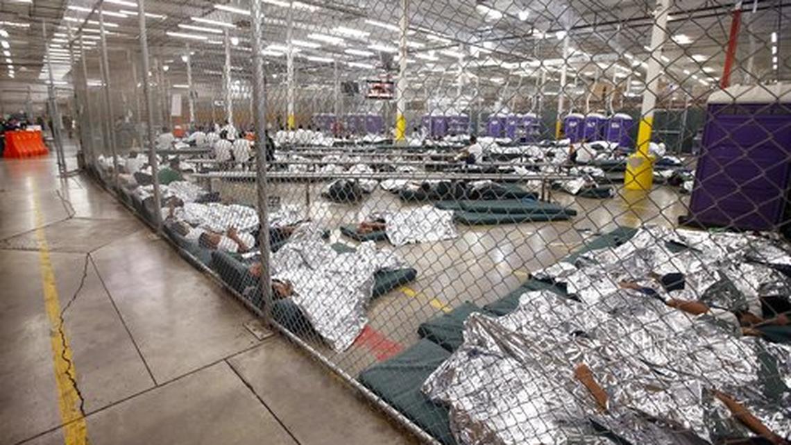 Detainees sleep and watch television in a holding cell where hundreds of mostly Central American immigrant children are being processed and held at the U.S. Customs and Border Protection Nogales Placement Center in Nogales, Ariz in this June 18, 2014, file photo. The CPB provided media tours in Brownsville, Texas, and Nogales, that have been central to processing unaccompanied children.