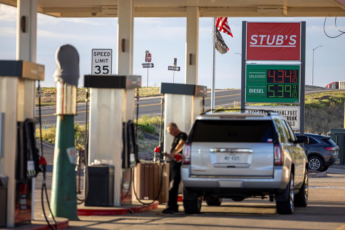 A driver fills up his vehicle at a gas station in Wiggins, Colorado, U.S., May 11, 2026.  REUTERS/Kevin Mohatt