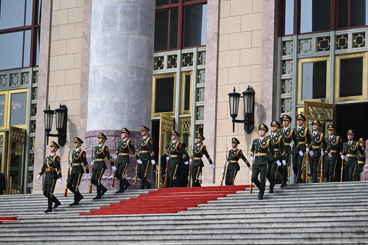 An honor guard outside the Great Hall of the People in Beijing on Thursday, May 14, 2026, during President Donald Trump's visit to China for a two-day summit with President Xi Jinping of China. (Kenny Holston/The New York Times)