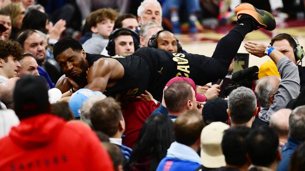 Donovan Mitchell dives into the crowd. 