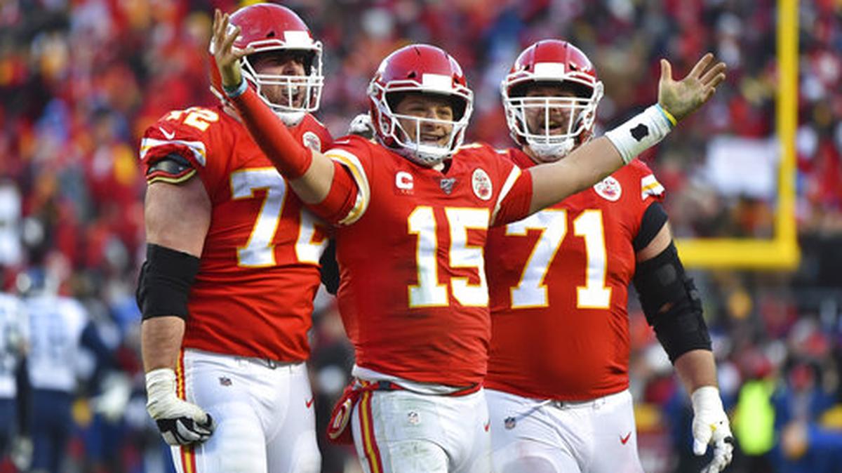 Kansas City Chiefs’ Patrick Mahomes (15) celebrates a touchdown pass with Eric Fisher (72) and Mitchell Schwartz (71) during the second half of the NFL AFC Championship football game against the Tennessee Titans on Jan. 19, 2020, in Kansas City.