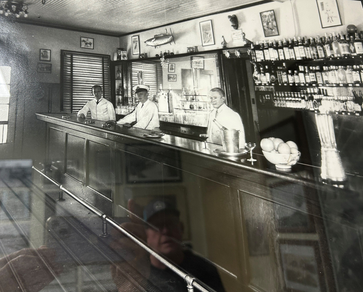 The original bar that became Earl's Hideaway biker bar in Sebastian, Florida, was in the Sebastian Inn on the Indian River Lagoon from 1946-55. In 1942, Earl Roberts moved from New Lebanon, New York, where he owned two restaurants and the famous Showboat nightclub, to New Smyrna Beach, Florida, where he bought a train station restaurant in 1943. The Sebastian Inn was built in 1925, opened in 1926, and expanded northward over the years. Earl bought the hotel in 1944, but didn't reopen it until the Navy vacated after WWII in 1946, having immediately commandeered it for barracks. Earl renamed the bar Earl's Bar and Package Store, he renamed the restaurant the Marine Room, and he opened the new Picture Window Cocktail Lounge in 1948. Earl and life partner Grace Martin lived in the hotel and she was the restaurant hostess and hotel assistant manager. The hotel portion was closed circa 1950 and the entire property was foreclosed and sold in 1955. The couple moved the bar "3/4 miles north on left," a sign said. In 1960, they co-leased the bar, restaurant and two cottages at 1405 Indian River Drive, where they lived. In 1965, Grace bought the bar; the liquor license was in her name; and they soon renamed it Earl's Hideaway. In 1968, the Sebastian Inn was razed to build today's Sportsman's Lodge and Marina at 412 Indian River Drive.