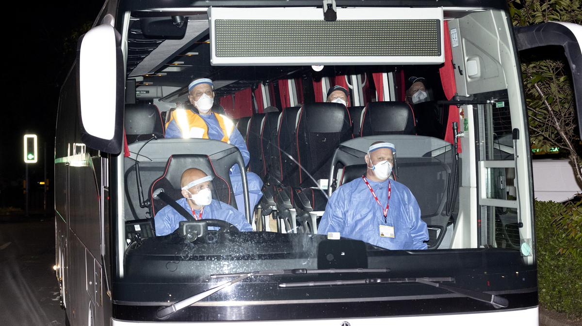 The bus carrying British passengers and crew being repatriated from the MV Hondius makes its way to Arrowe Park Hospital on Sunday, May 10, 2026, in Birkenhead, England. Twenty-two British passengers and crew from the MV Hondius, who have tested negative for hantavirus, have been repatriated via charter flight from Tenerife  and taken to Arrowe Park Hospital in Wirral for clinical assessment. (Ryan Jenkinson/Getty Images/TNS)