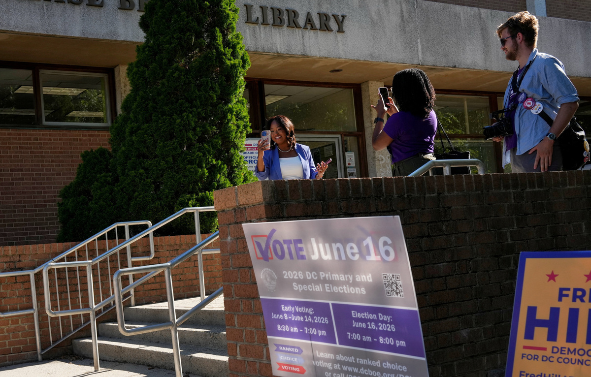 DC Mayoral candidate Janeese Lewis George records a video for social media near a voting site at the Chevy Chase Community Center during DC’s primary voting day in Washington, D.C., U.S., June 16, 2026. REUTERS/Leah Millis