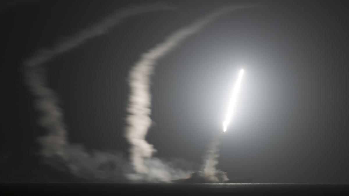 The guided missile cruiser USS Philippine Sea (CG 58) launches a Tomahawk cruise missile, as seen from the aircraft carrier USS George H.W. Bush (CVN 77), in the Persian Gulf Sept. 23, 2014. (Mass Communication Specialist 1st Class Eric Garst/U.S. Navy/TNS)