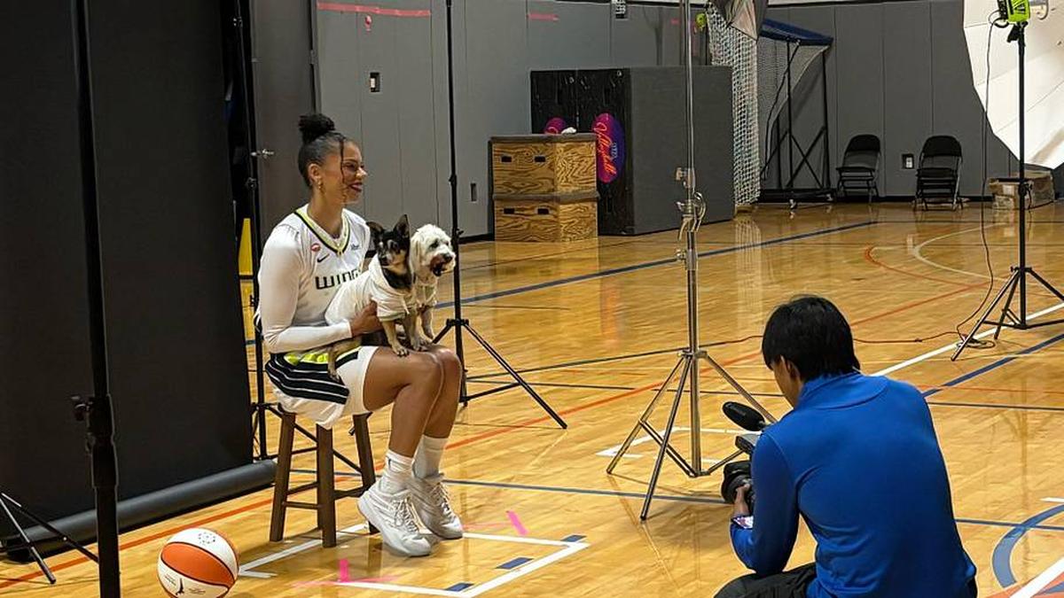  Clark brought her pups Sly and Cecil to Media Day in Dallas. | Emma Baccellieri/Sports Illustrated 