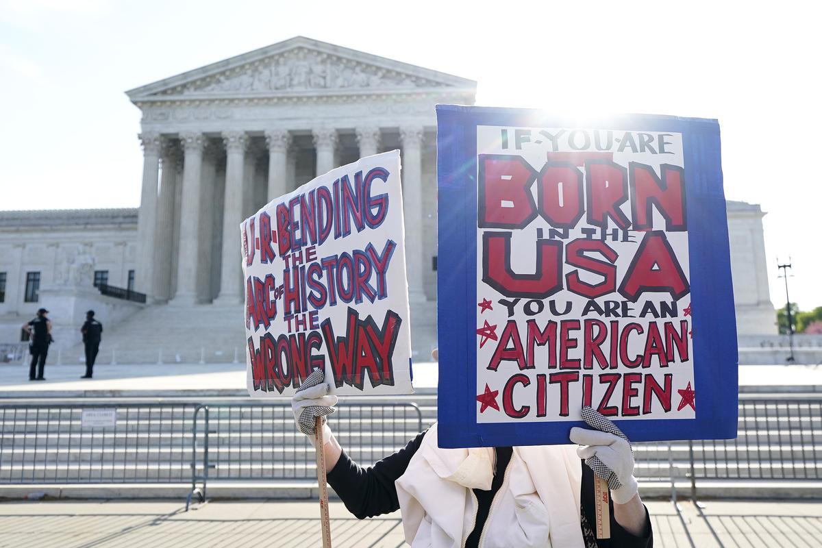  A pro-birthright citizenship protester stands outside the U.S. Supreme Court on April 1, 2026. 