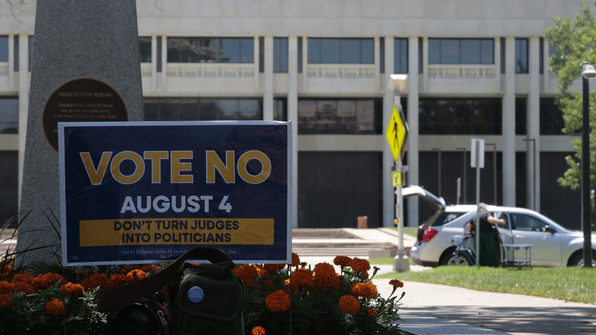 During a protest on the Statehouse lawn, a vote no sign for the constitutional amendment election is seen across the street from the Kansas Judicial Center where the state Supreme Court works.