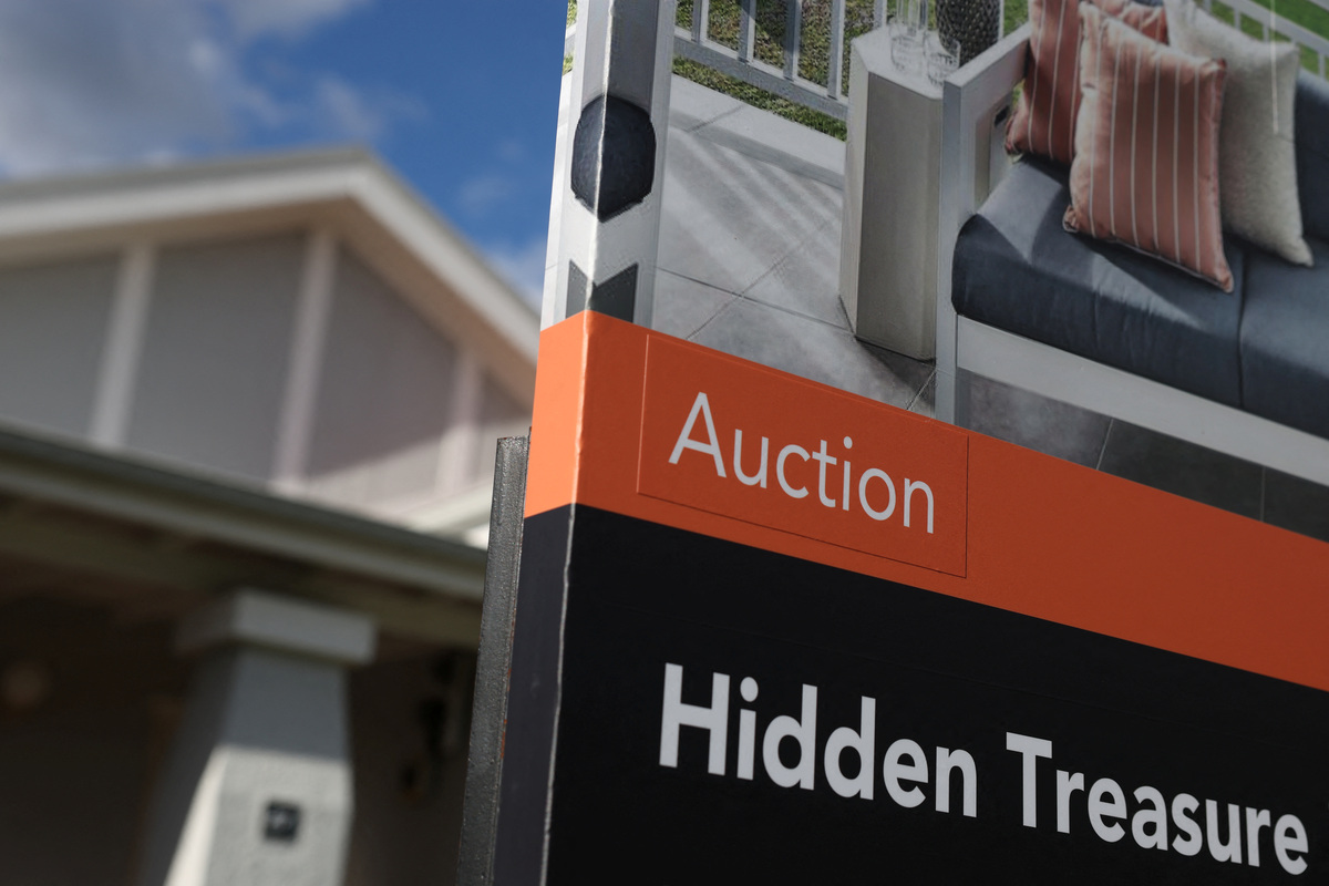 An auction sign stands outside a property in Sydney, Australia, June 22, 2026. REUTERS/Hollie Adams