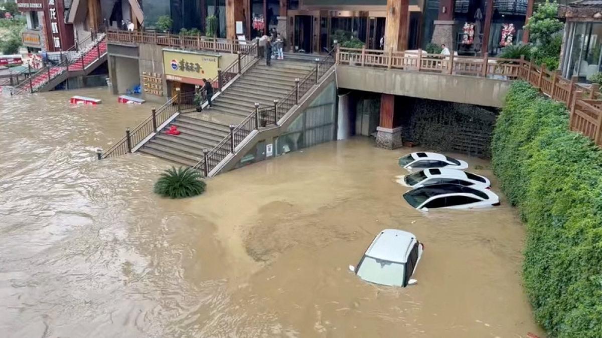 Cars lie partially submerged in floodwaters after heavy rainfall in Duyun, Guizhou Province, China, May 19, 2026, in this still image obtained from a social media video. Social Media/via REUTERS
