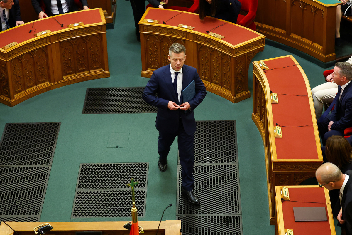 Hungarian Prime Minister Peter Magyar walks to deliver a speech on the day new members of government take their oath of office in the Parliament, in Budapest, Hungary, May 12, 2026. REUTERS/Bernadett Szabo