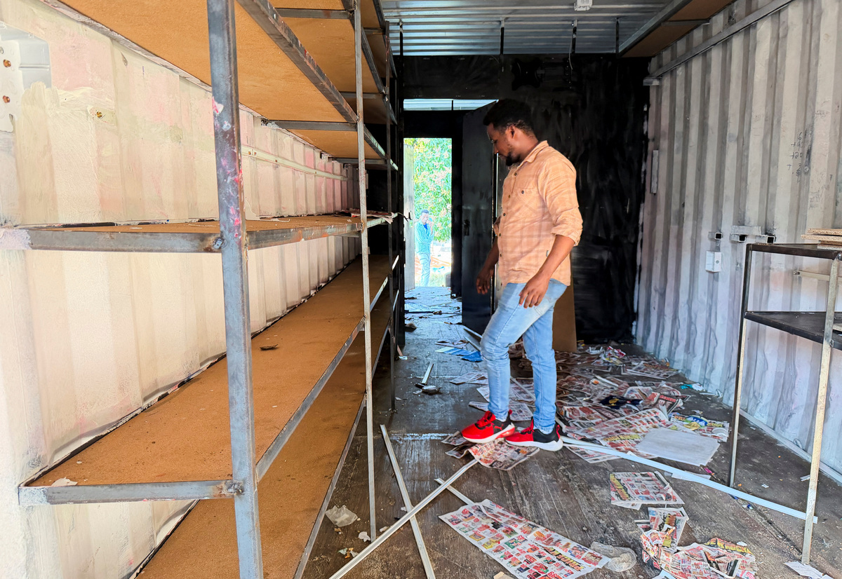 Ethiopian refugee Daniel Abide inspects his looted shop after xenophobic protests in kwaDabeka, Durban, South Africa, July 1, 2026. REUTERS/Siyabonga Sishi