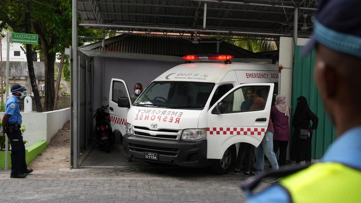 An ambulance carrying the body of one of the five Italian scuba divers who died in an accident in underwater caves, arrives at a mortuary in Male, Maldives, May 19, 2026. REUTERS/Thilina Kaluthotage