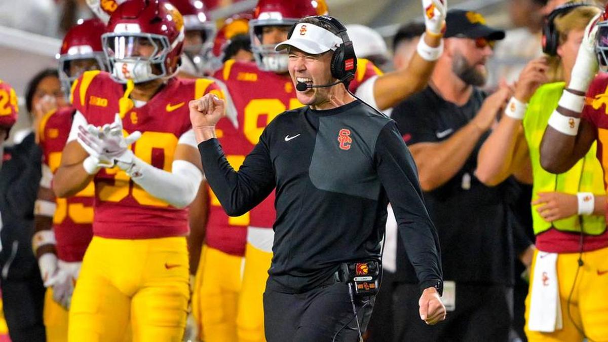  Oct 11, 2025; Los Angeles, California, USA; USC Trojans head coach Lincoln Riley celebrates after kicker Ryon Sayeri (48) hit a 54-yard field goal in the second half against the Michigan Wolverines at United Airlines Field at the Los Angeles Memorial Coliseum. Mandatory Credit: Jayne Kamin-Oncea-Imagn Images | Jayne Kamin-Oncea-Imagn Images 