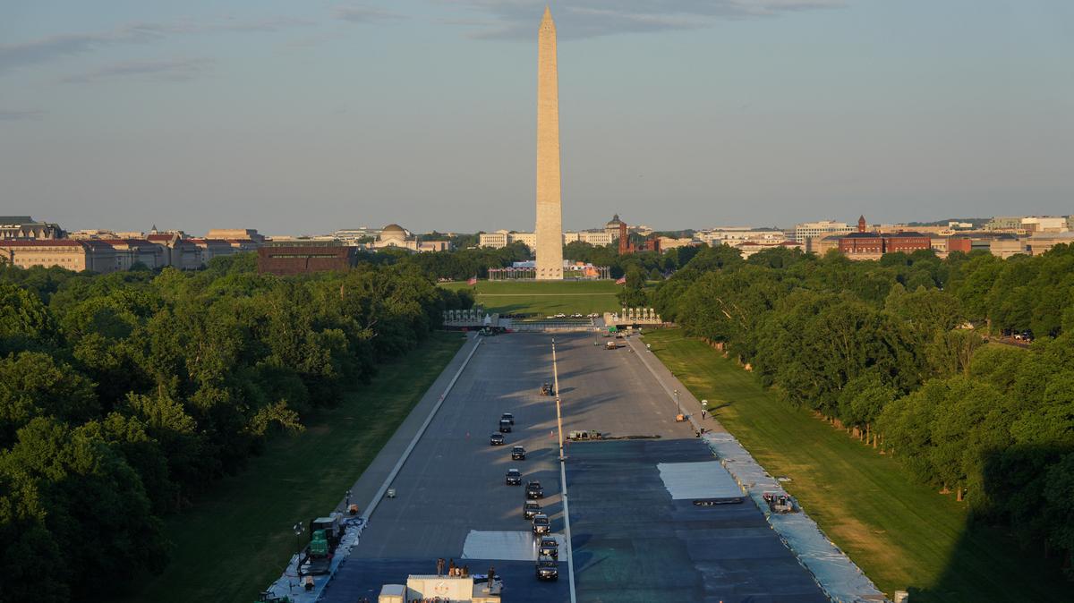 The motorcade with President Donald Trump drives in the Lincoln Memorial Reflecting Pool during a visit to see the new blue protective coating being applied as part of a renovation project, Thursday, May 7, 2026, in Washington.     Alex Brandon/Pool via REUTERS