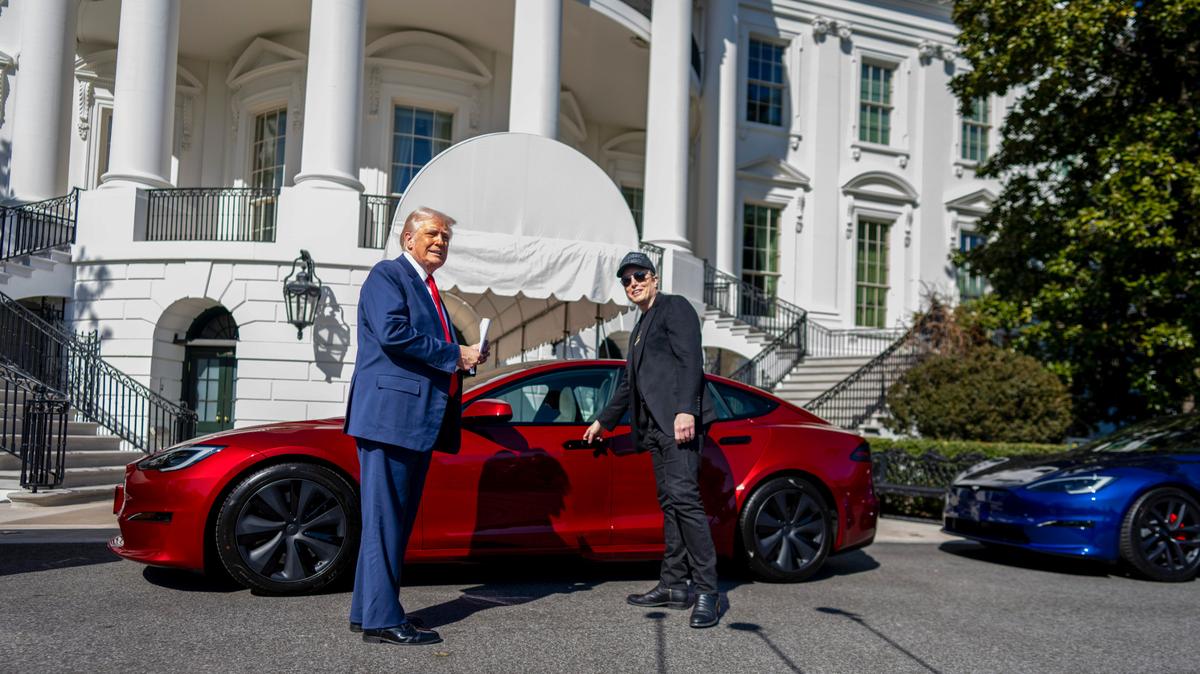 President Donald Trump and Elon Musk look at Tesla vehicles on the South Grounds of the White House in Washington, on Tuesday, March 11, 2025.
