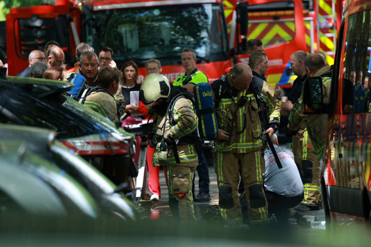 Firefighters work at the site of a fire in a housing building in Antwerp, Belgium, July 1, 2026. REUTERS/Yves Herman