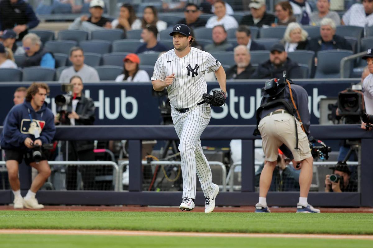  May 22, 2026; Bronx, New York, USA; New York Yankees starting pitcher Gerrit Cole (45) runs onto the field before his start against the Tampa Bay Rays at Yankee Stadium. Mandatory Credit: Brad Penner-Imagn Images 