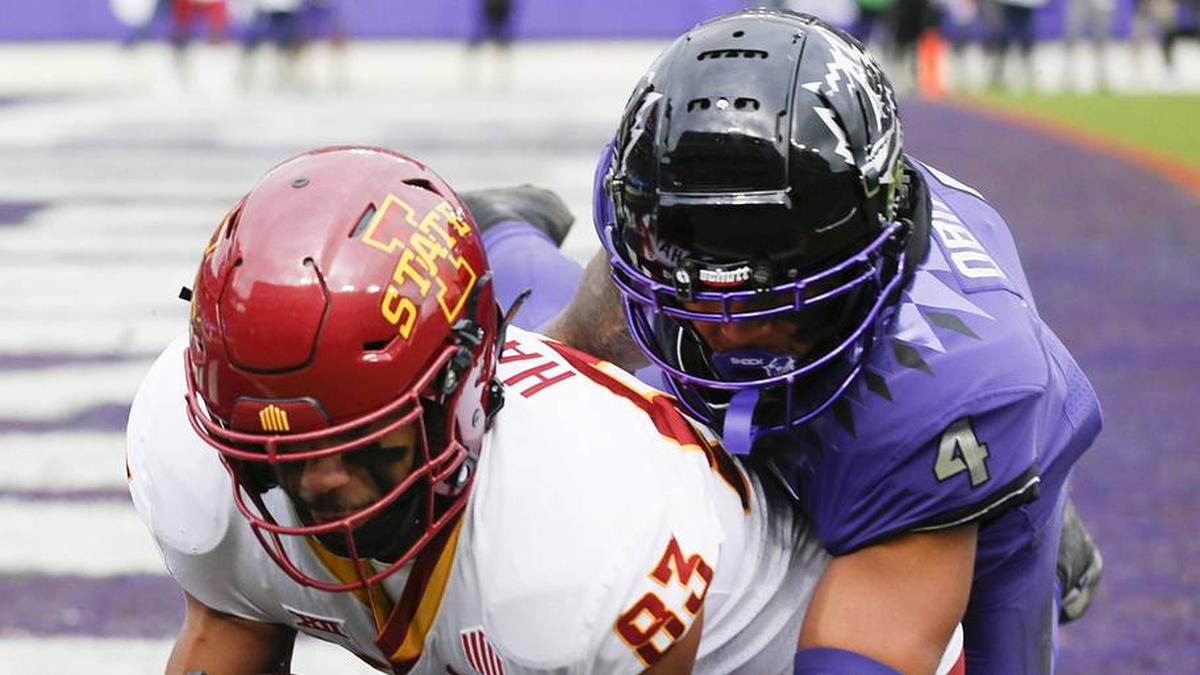  Nov 26, 2022; Fort Worth, Texas, USA; Iowa State Cyclones tight end DeShawn Hanika (83) makes the 15-yard touchdown catch in front of TCU Horned Frogs safety Namdi Obiazor (4) during the first half at Amon G. Carter Stadium. Mandatory Credit: Raymond Carlin III-Imagn Images | Raymond Carlin III-Imagn Images 