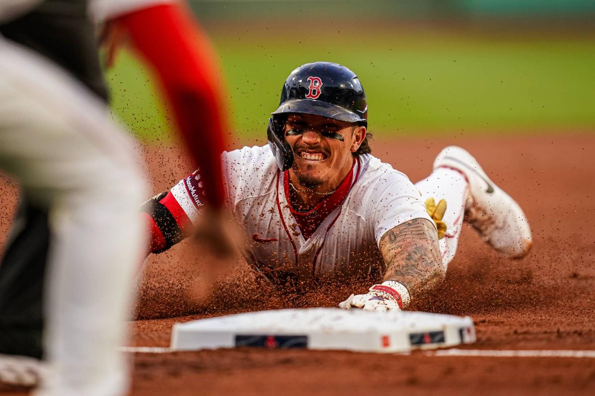  Boston Red Sox outfielder Jarren Duran (16) slides into third base for a triple against the Seattle Mariners in the first inning at Fenway Park. David Butler II-Imagn Images David Butler II-Imagn Images