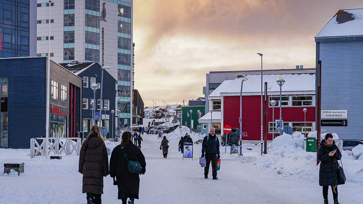 People walk along the main shopping street in Nuuk, Greenland, on Jan. 15, 2026.