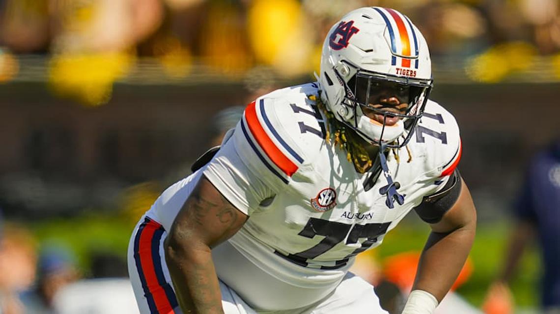  Oct 19, 2024; Columbia, Missouri, USA; Auburn Tigers offensive lineman Jeremiah Wright (77) gets ready before the snap during the second half against the Missouri Tigers at Faurot Field at Memorial Stadium. Mandatory Credit: Jay Biggerstaff-Imagn Images | Jay Biggerstaff-Imagn Images 