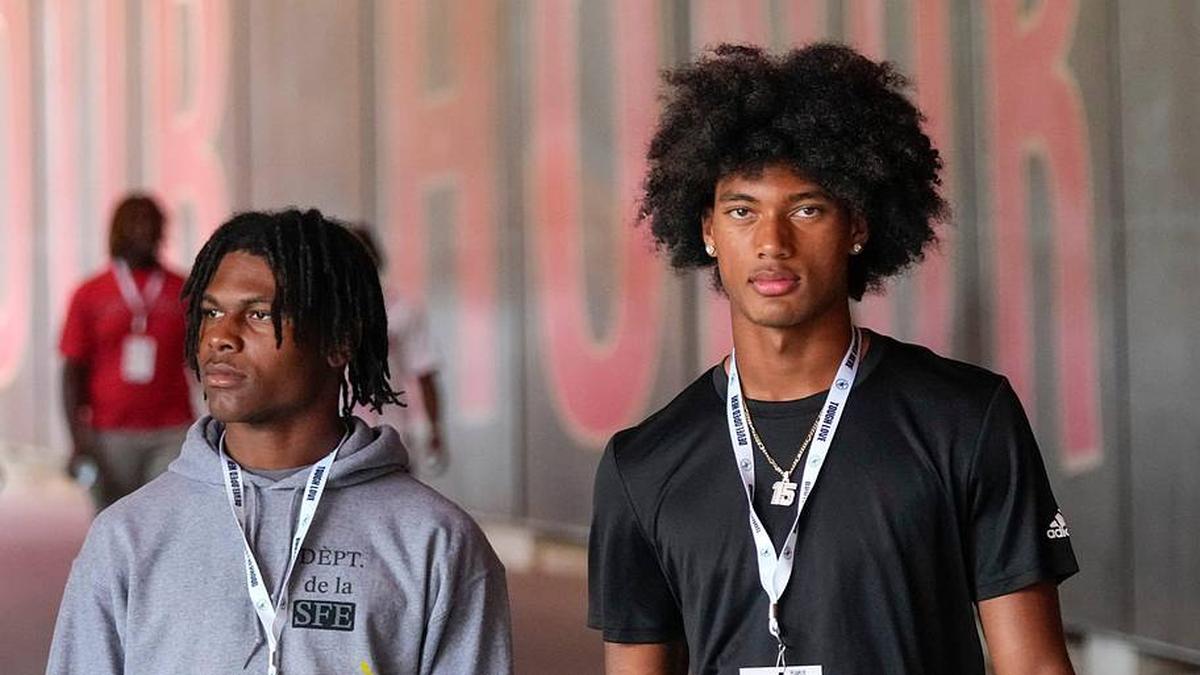  Aug 31, 2024; Columbus, OH, USA; Ohio State Buckeyes recruits Kayden Dixon-Wyatt and Chris Henry Jr. walk onto the field prior to the NCAA football game against the Akron Zips at Ohio Stadium. Ohio State won 52-6. | Adam Cairns/Columbus Dispatch / USA TODAY NETWORK via Imagn Images 