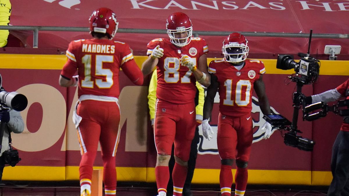 Kansas City Chiefs tight end Travis Kelce (87) celebrates his 20-yard touchdown reception with Patrick Mahomes (15) Tyreek Hill (10) in the second half of an NFL football game against the Denver Broncos in Kansas City on Sunday, Dec. 6, 2020.