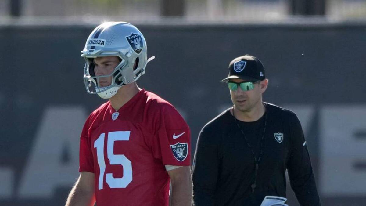  Jun 9, 2026; Henderson, NV, USA; Las Vegas Raiders quarterback Fernando Mendoza (15) and coach Klint Kubiak during minicamp at Intermountain Health Performance Center. Mandatory Credit: Kirby Lee-Imagn Images | Kirby Lee-Imagn Images 