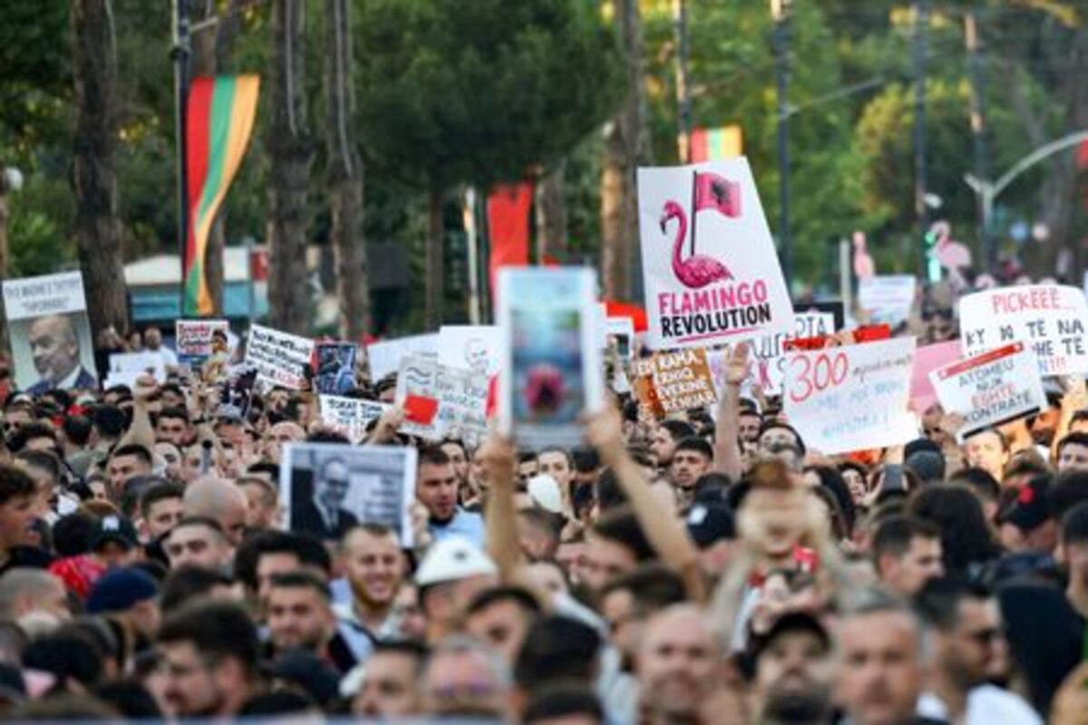 Protesters hold banners during a protest against a luxury resort development planned by a company linked with Donald Trump's son-in-law, Jared Kushner, on an environmentally sensitive part of the Adriatic coast, in Tirana, Albania, June 4, 2026. REUTERS/Florion Goga