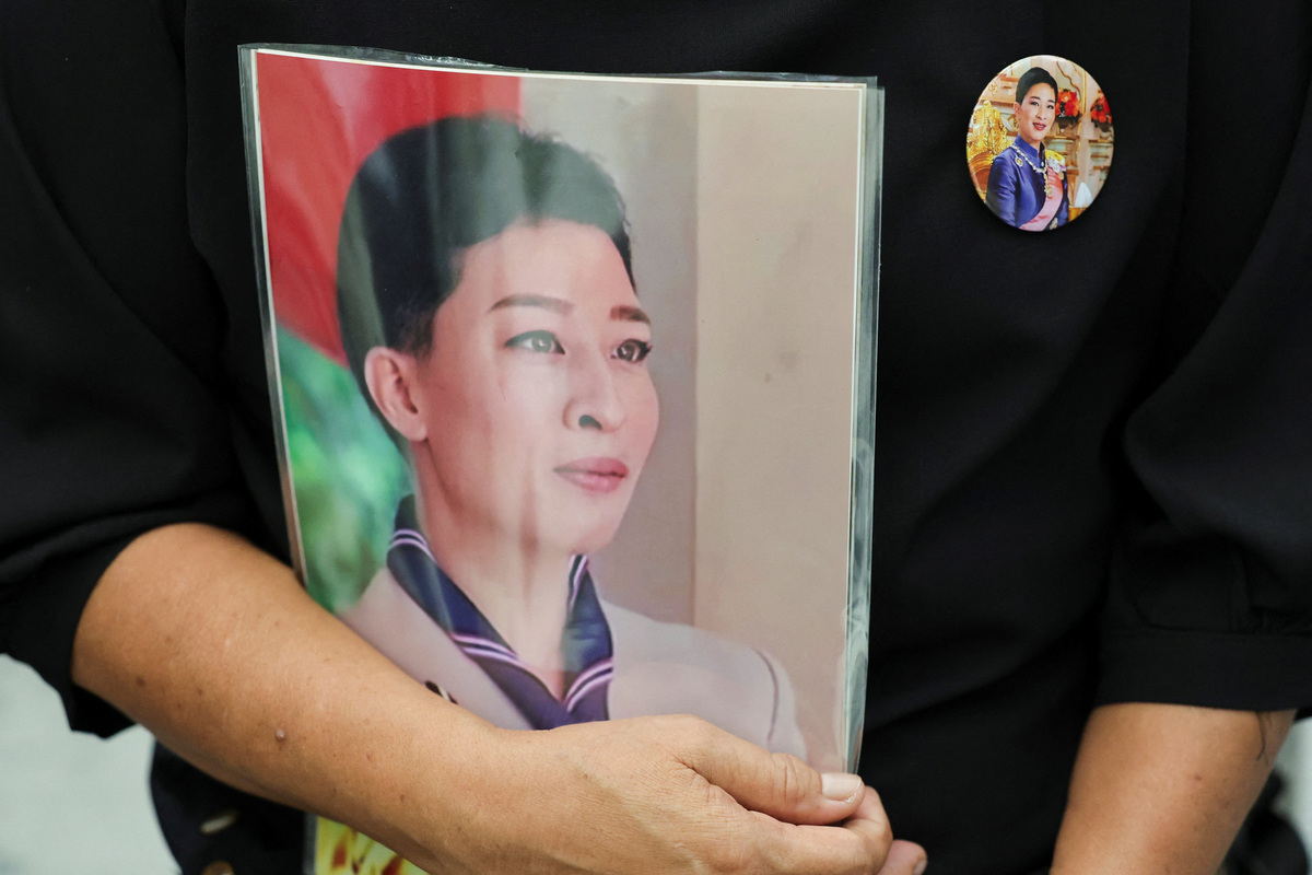 A person wears a badge with the picture of Thailand's Princess Bajrakitiyabha, 47, the eldest daughter of Thai King Maha Vajiralongkorn, following the announcement of her death, outside King Chulalongkorn Memorial Hospital in Bangkok, Thailand, June 12, 2026. REUTERS/Athit Perawongmetha