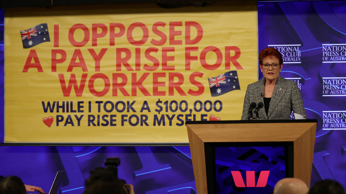 A protest banner appears during Australian Senator and One Nation leader Pauline Hanson's address at the National Press Club in Canberra, Australia, June 17, 2026. REUTERS/Hollie Adams