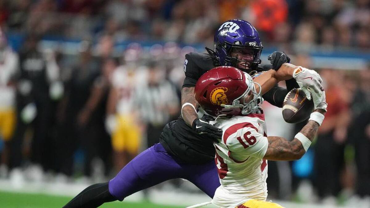  Dec 30, 2025; San Antonio, TX, USA; Southern California Trojans wide receiver Tanook Hines (16) catches the ball against TCU Horned Frogs cornerback Vernon Glover (26) in the second half during the Alamo Bowl at Alamodome. Mandatory Credit: Kirby Lee-Imagn Images | Kirby Lee-Imagn Images 