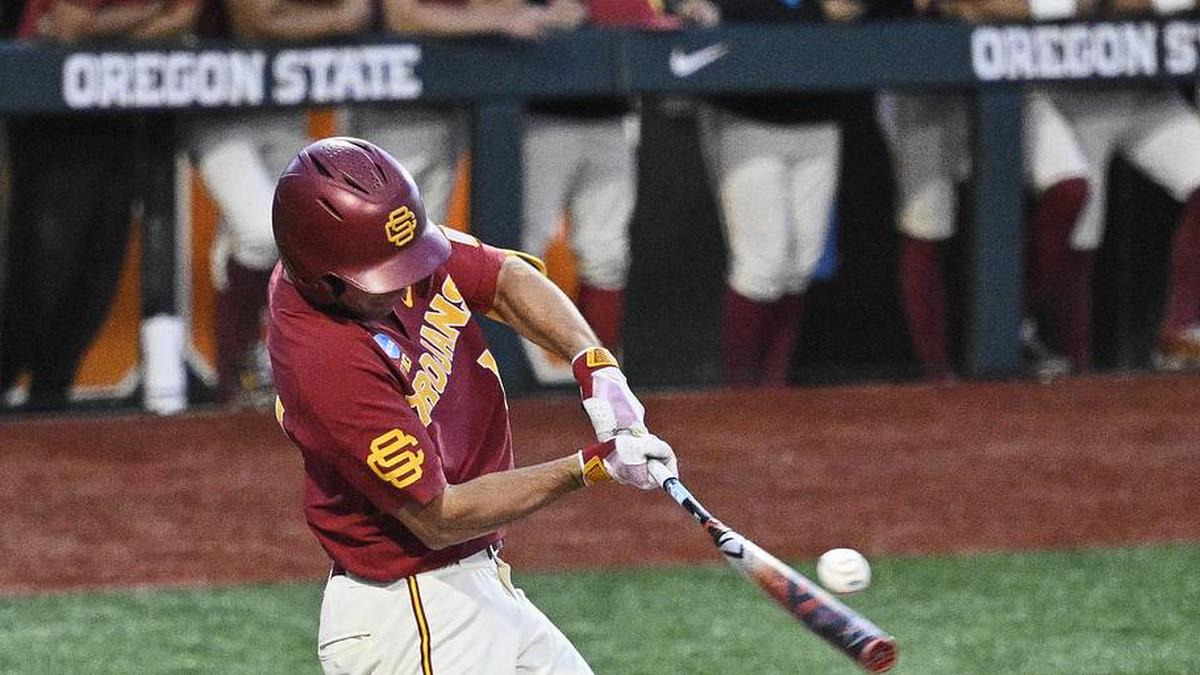  May 31, 2025; Corvallis, OR, USA; USC outfielder Jack Basseer (14) hits the ball during the eighth inning against Saint Mary's at the NCAA Corvallis Regional at Goss Stadium. Mandatory Credit: Troy Wayrynen-Imagn Images | Troy Wayrynen-Imagn Images 