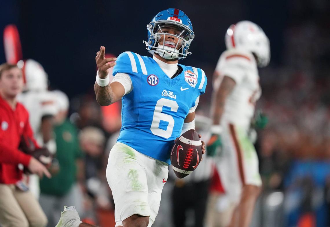  Ole Miss Rebels quarterback Trinidad Chambliss (6) signals a first down after his run against the Miami Hurricanes during their Vrbo Fiesta Bowl matchup at State Farm Stadium on Jan. 8, 2026. 