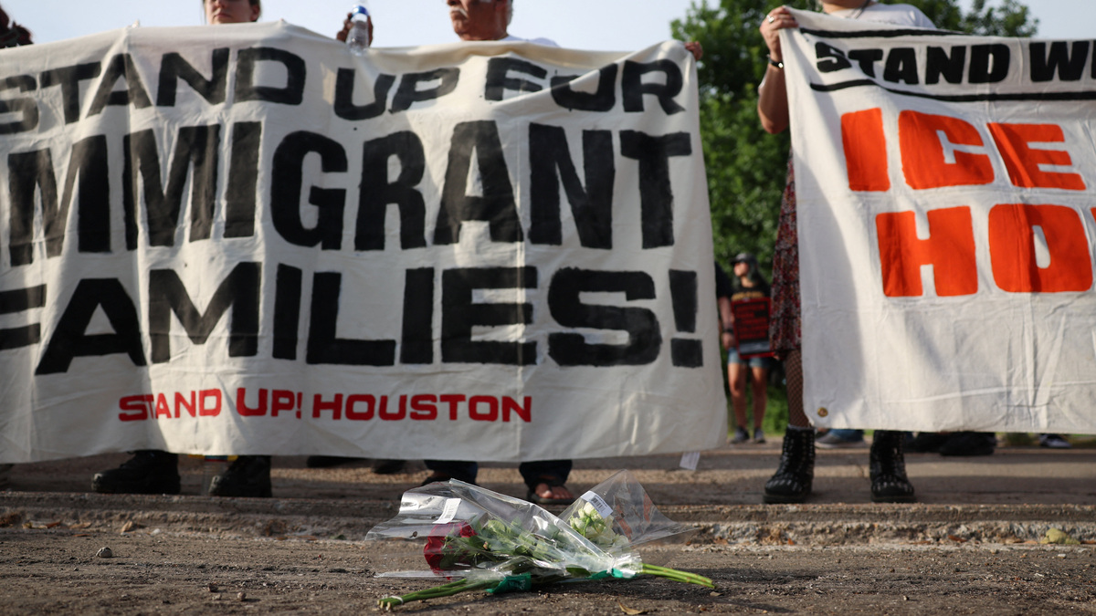 Flowers lie on the ground as people hold a vigil after the fatal shooting of Mexican motorist Lorenzo Salgado Araujo by an ICE agent in Houston, Texas, U.S., July 8, 2026.  REUTERS/Antranik Tavitian