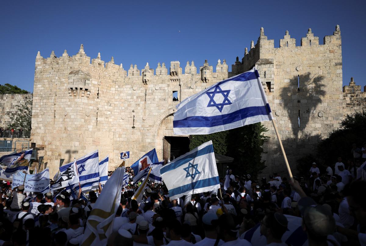 People gather as they take part in the annual Jerusalem Day march in the Old City of Jerusalem, May 14, 2026. REUTERS/Ammar Awad