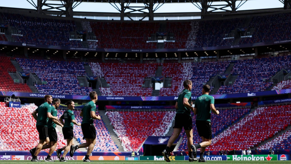 ISTANBUL, TURKEY - MAY 19: Referees Francois Letexier, Cyril Mugnier, Mehdi Rahmouni, Alejandro Jose Hernandez Hernandez, Jose Enrique Naranjo Perez, Jerome Brisard, Willy Delajod and Johan Dennis Hilger warm up during a training session ahead of the UEFA Europa League Final 2026 match between SC Freiburg and Aston Villa FC at Besiktas Park on May 19, 2026 in Istanbul, Turkey. (Photo by Alex Caparros - UEFA/UEFA via Getty Images).