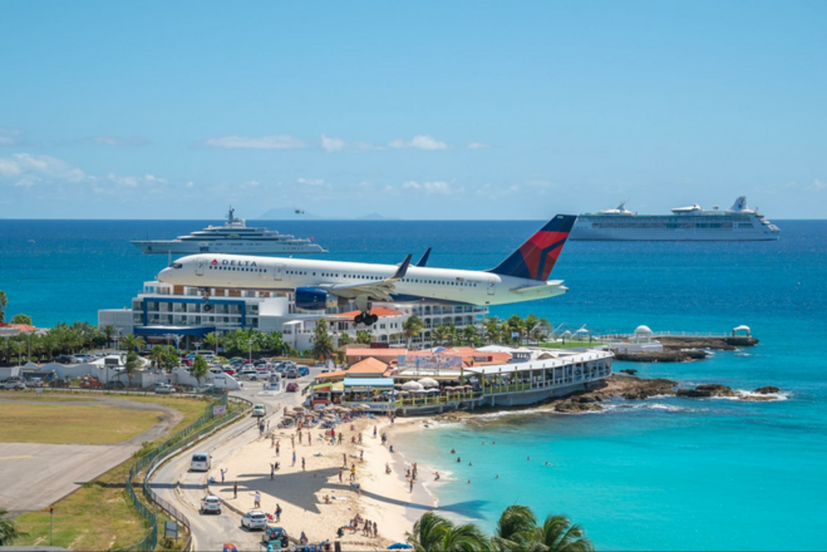 Since the runway is mere steps from the beach, watching planes come in for a landing from the water is a popular St. Maarten pastime. Photo credit: Sonesta St. Maarten