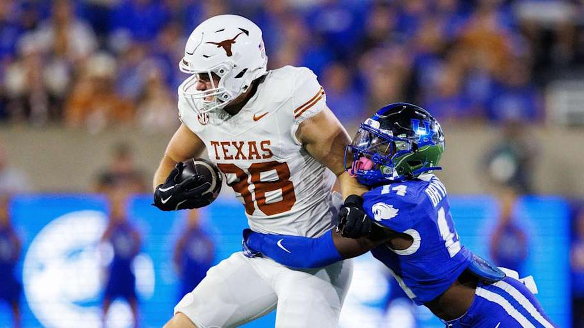  Oct 18, 2025; Lexington, Kentucky, USA; Texas Longhorns tight end Jack Endries (88) is tackled by Kentucky Wildcats defensive back Ty Bryant (14) during the second quarter at Kroger Field. Mandatory Credit: Jordan Prather-Imagn Images | Jordan Prather-Imagn Images 