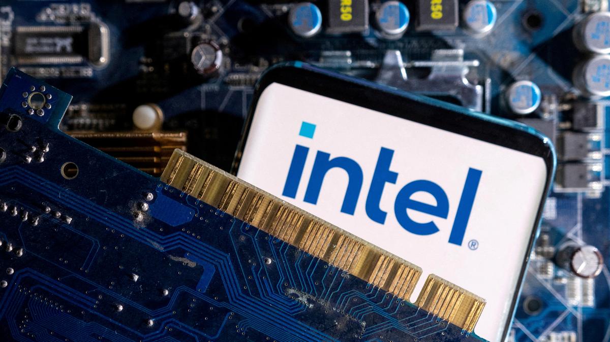 FILE PHOTO: A smartphone with a displayed Intel logo is placed on a computer motherboard in this illustration created on March 6, 2023. REUTERS/Dado Ruvic/Illustration/File Photo