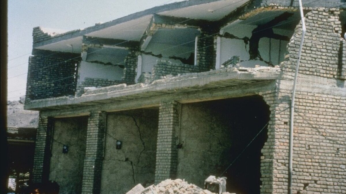 A concrete building is damaged in Walls, Iran, after a 7.7-magnitude earthquake struck the region June 21, 1990. File Photo by M. Mehrain, Dames and Moore/NOAA