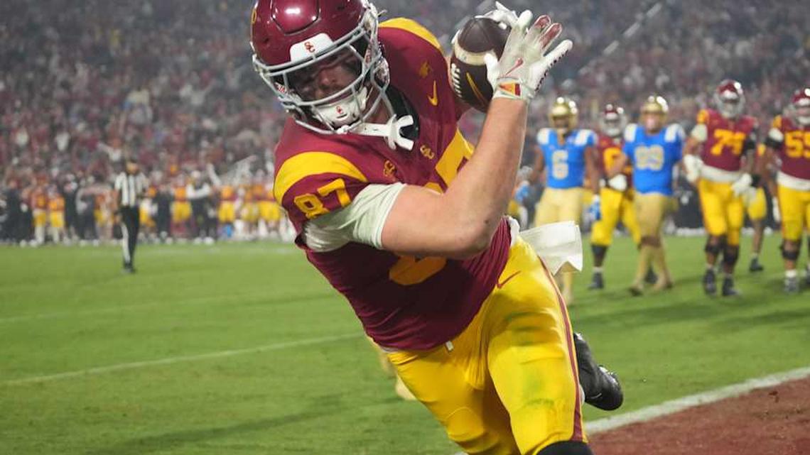  Nov 29, 2025; Los Angeles, California, USA; Southern California Trojans tight end Lake McRee (87) catches a 2-yard touchdown pass against the UCLA Bruins in the second half at United Airlines Field at Los Angeles Memorial Coliseum. Mandatory Credit: Kirby Lee-Imagn Images | Kirby Lee-Imagn Images 
