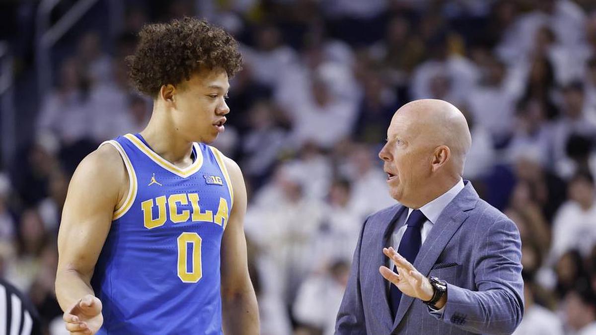  Feb 14, 2026; Ann Arbor, Michigan, USA; UCLA Bruins head coach Mick Cronin talks to guard Trent Perry (0) in the first half against the Michigan Wolverines at Crisler Center. Mandatory Credit: Rick Osentoski-Imagn Images | Rick Osentoski-Imagn Images 