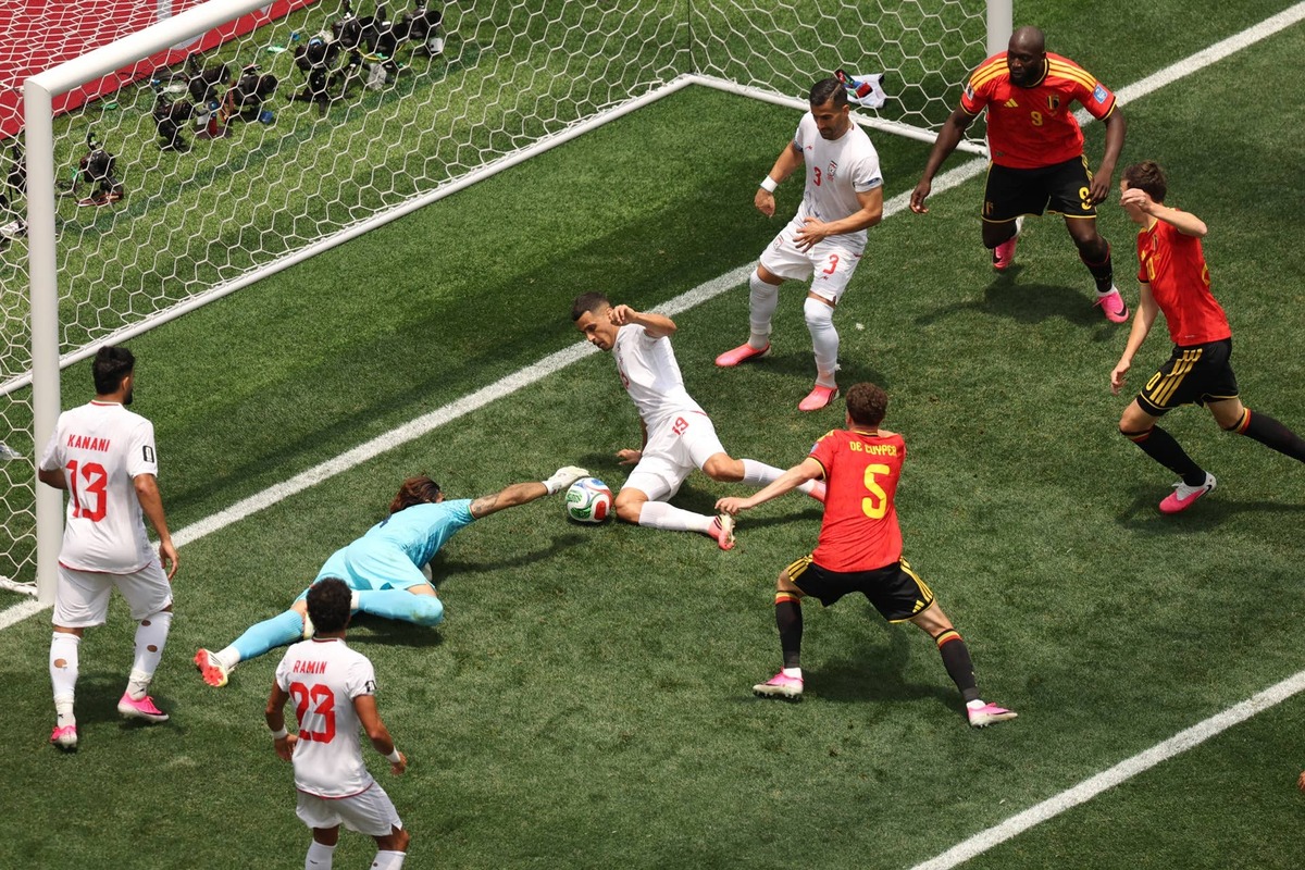  Iran's goalkeeper #01 Alireza Beiranvand makes a save past Belgium's defender #05 Maxim De Cuyper during the 2026 World Cup Group G football match between Belgium and Iran at the Los Angeles Stadium in Inglewood on June 21, 2026. (Photo by Etienne Laurent / AFP via Getty Images) Photo by Etienne Laurent / AFP via Getty Images