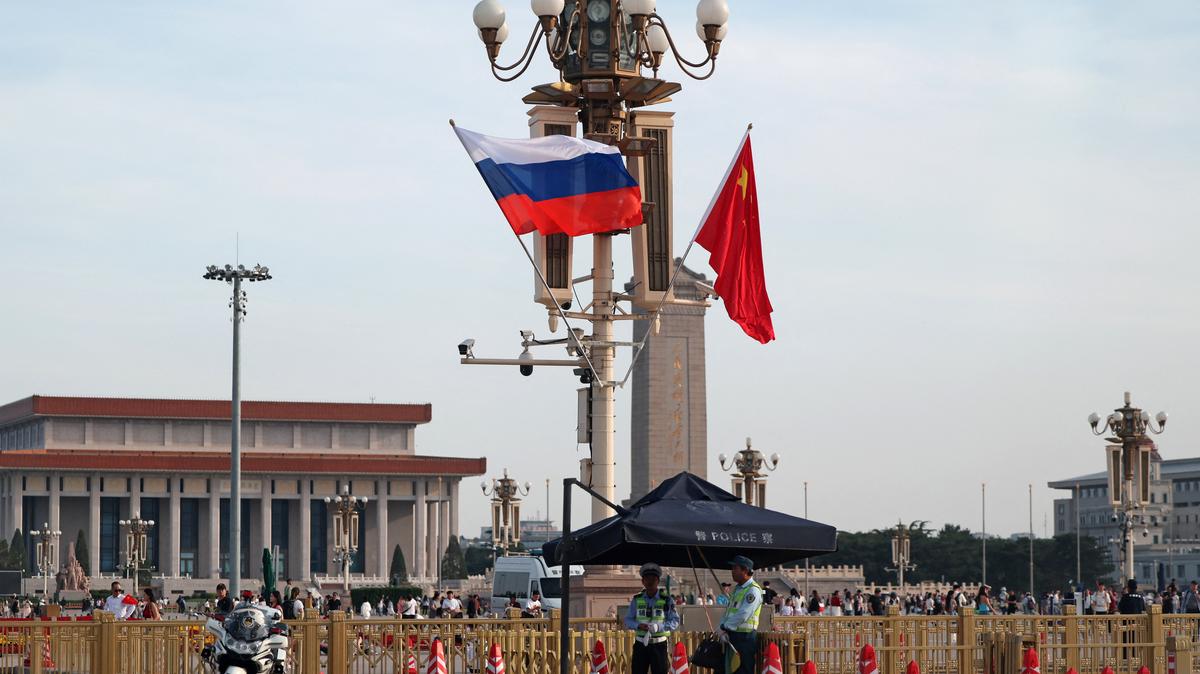 Police officers stand guard as Russia’s and China’s national flags fly in the Tiananmen Square, ahead of Russia's President Vladimir Putin visit to China, in Beijing, China, May 19, 2026. REUTERS/Maxim Shemetov