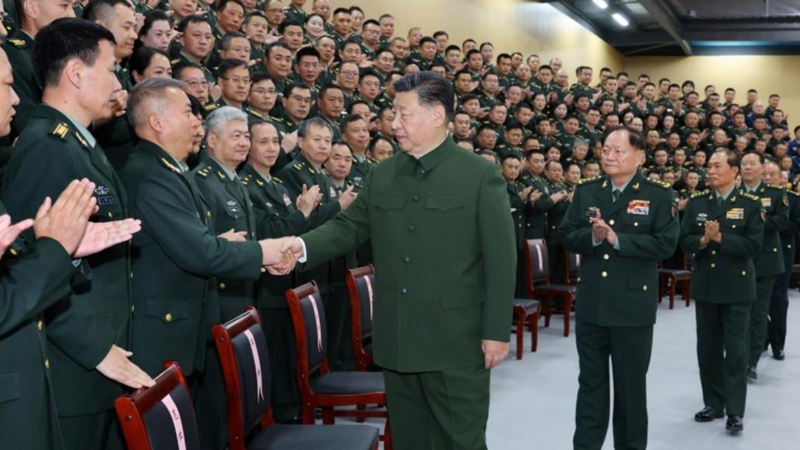 Chinese President Xi Jinping (C), who also serves as general secretary of the Communist Party of China Central Committee and chairman of the Central Military Commission, meets representatives during an inspection of the information support force of the Chinese People's Liberation Army (PLA) in Beijing, China. Photo by LI GANG / XINHUA / EPA